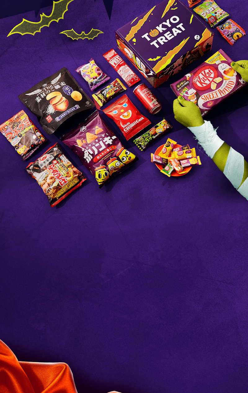 The special Halloween-edition TokyoTreat box sits against a dark purple background, surrounded by the Halloween box items.