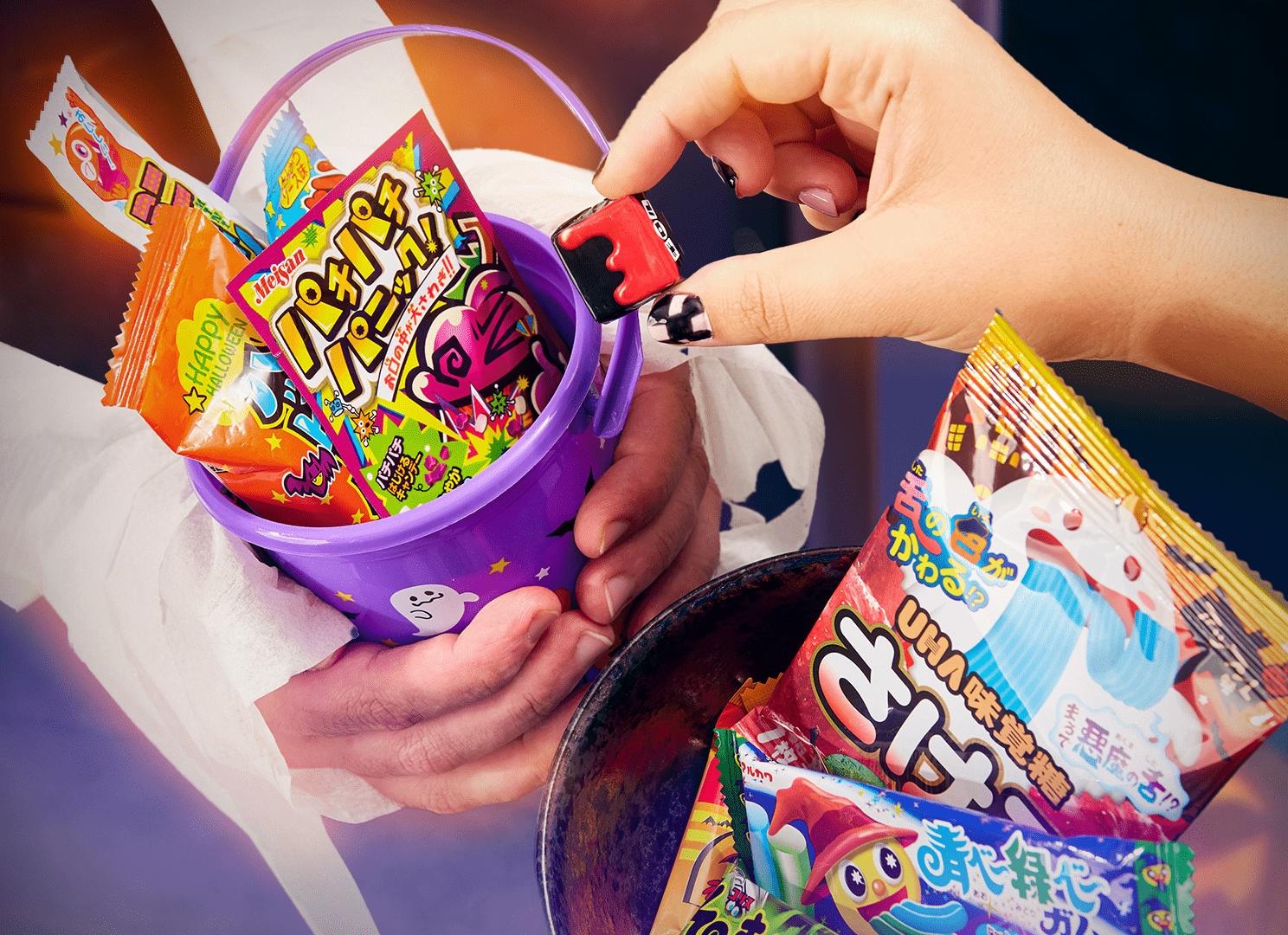 Halloween trick-or-treater gets Japanese candy. Halloween trick-or-treater gets Japanese candy.
