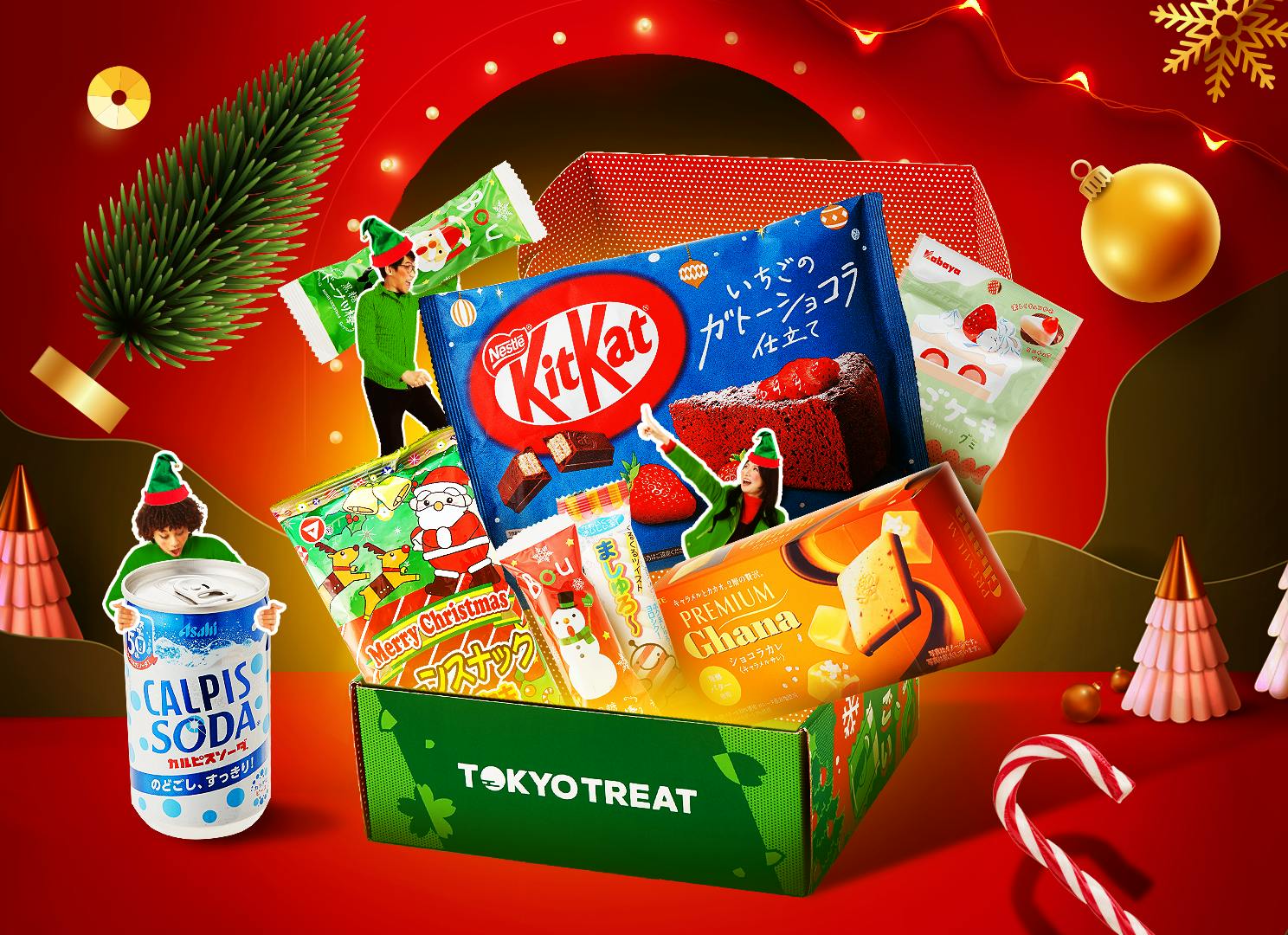 The Snacktacular Christmas box sits on a backdrop of Christmas & holiday elements, including lights, Christmas trees, and candy canes. The Snacktacular Christmas box sits on a backdrop of Christmas & holiday elements, including lights, Christmas trees, and candy canes.