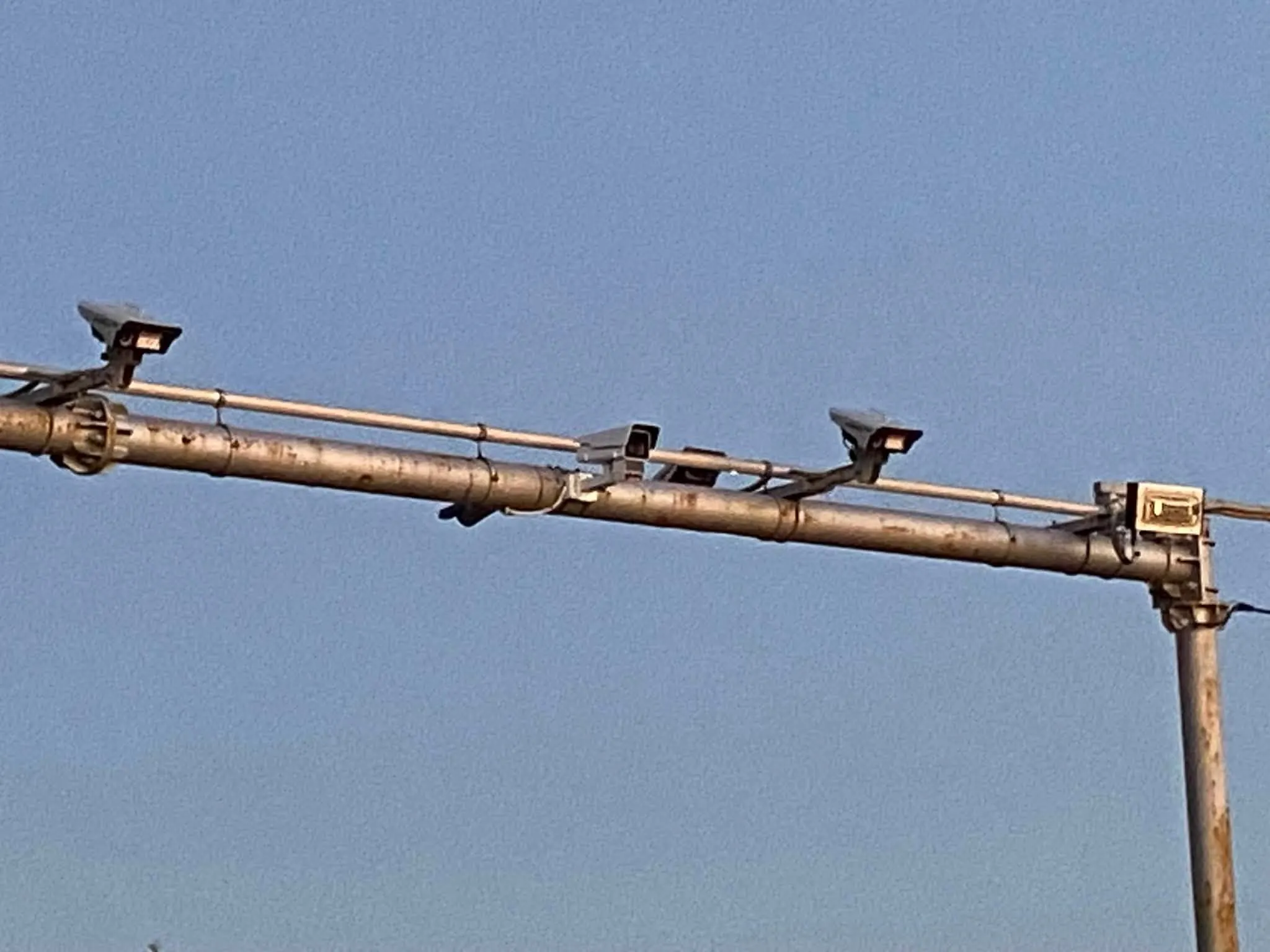 Two cameras on a single toll gantry — one for each direction of travel