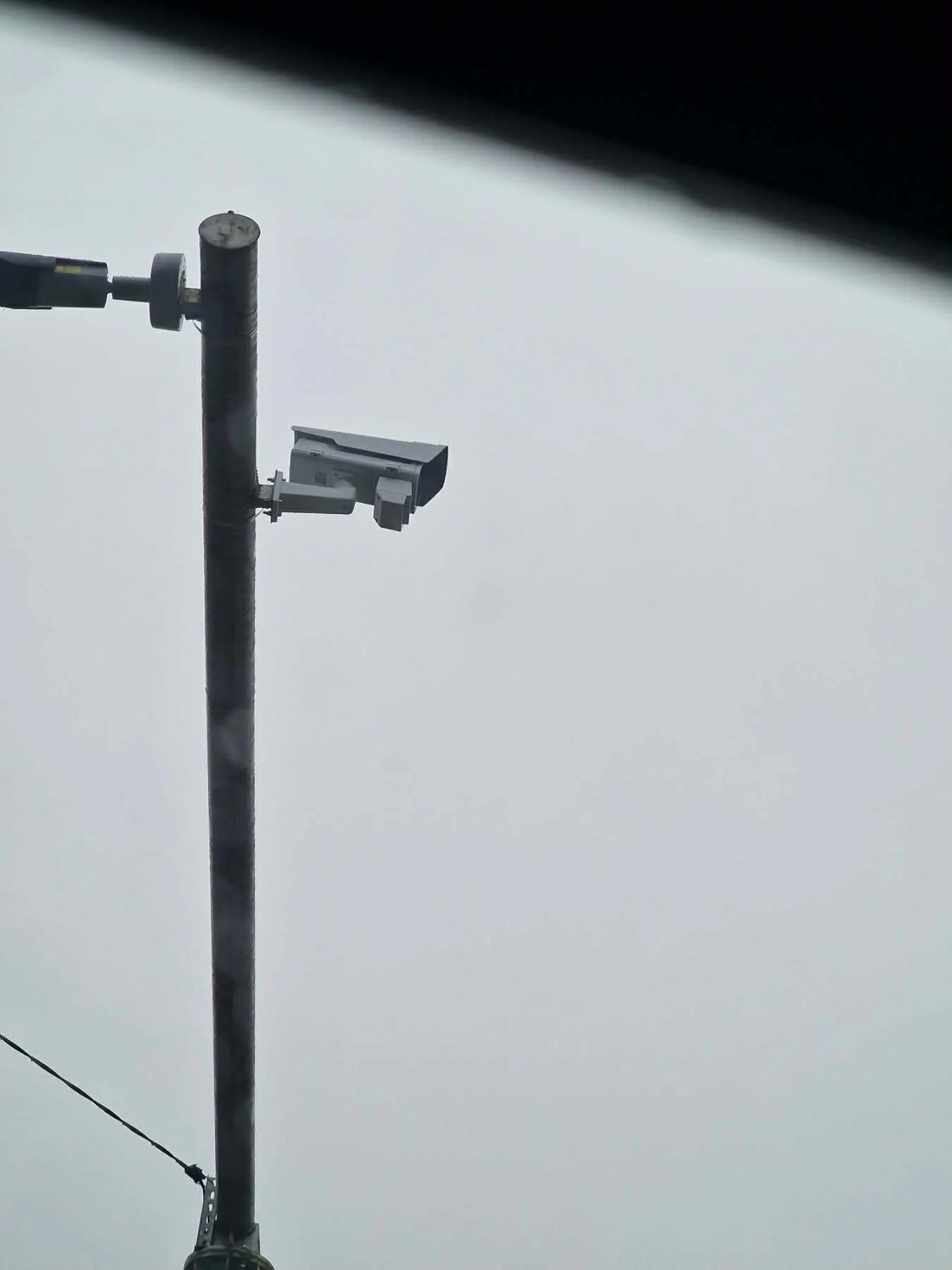 Another installation — the camera is hard to pick out against a grey sky