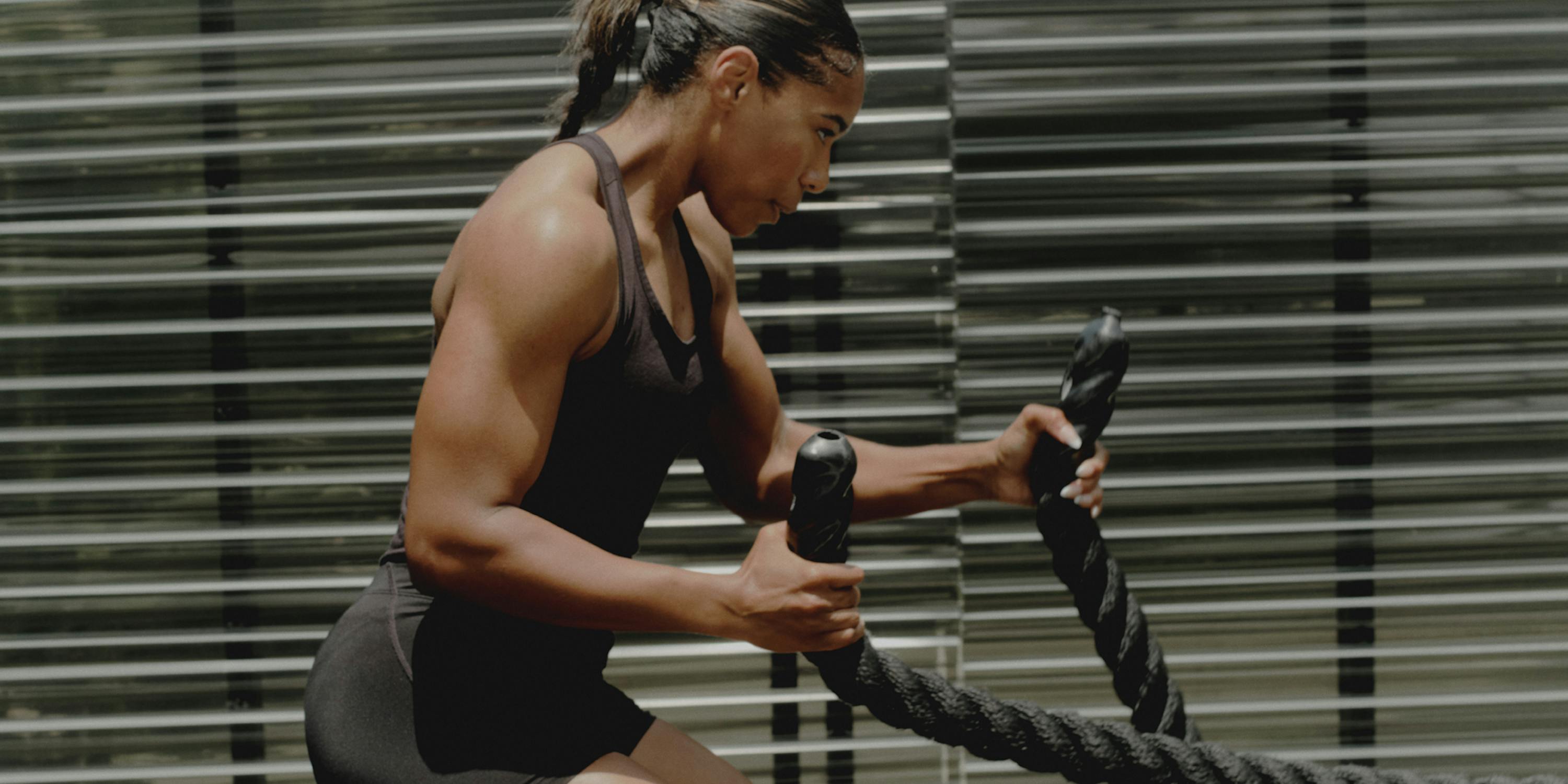 woman exercising with ropes