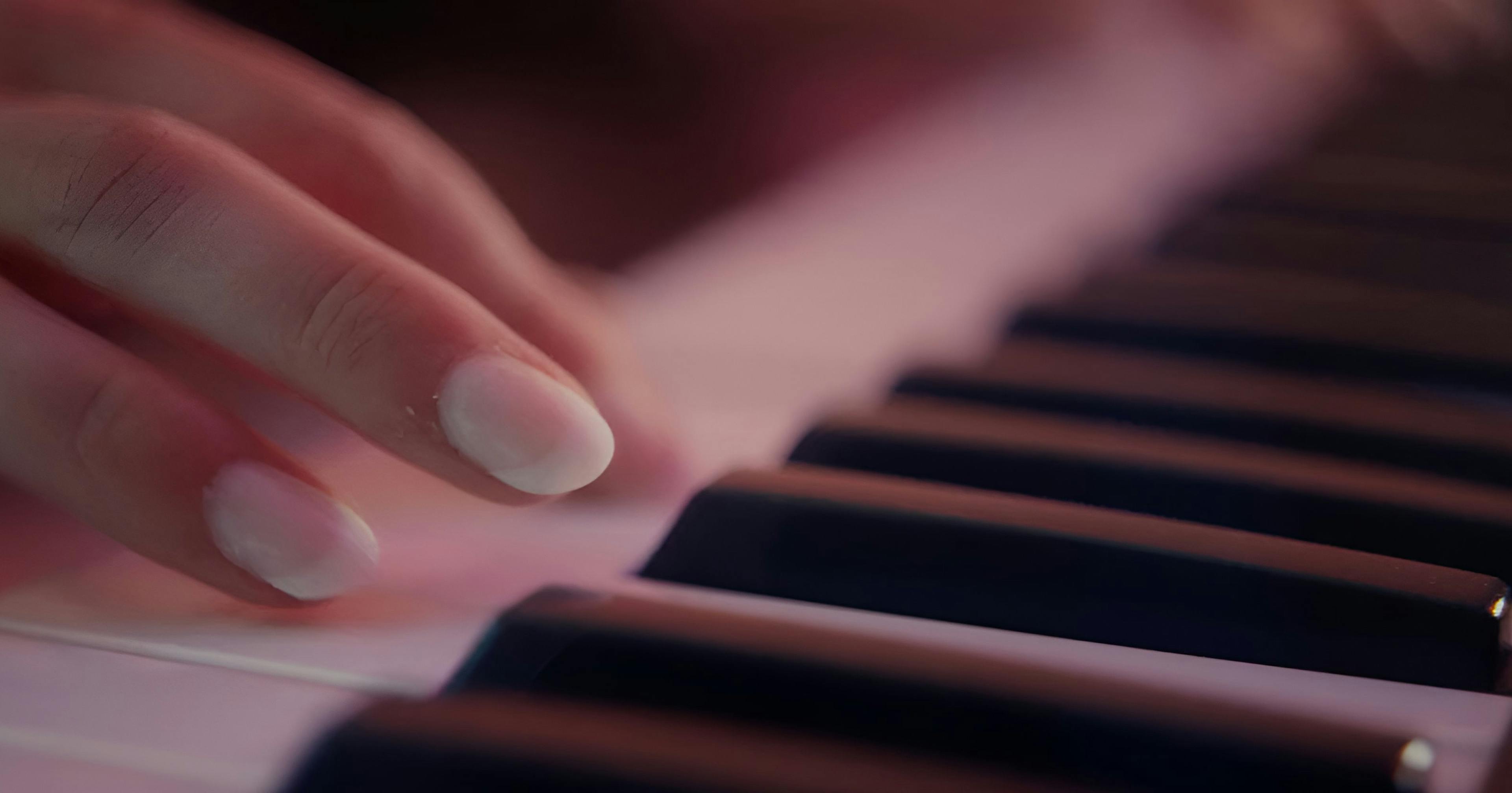 girl learning piano at home
