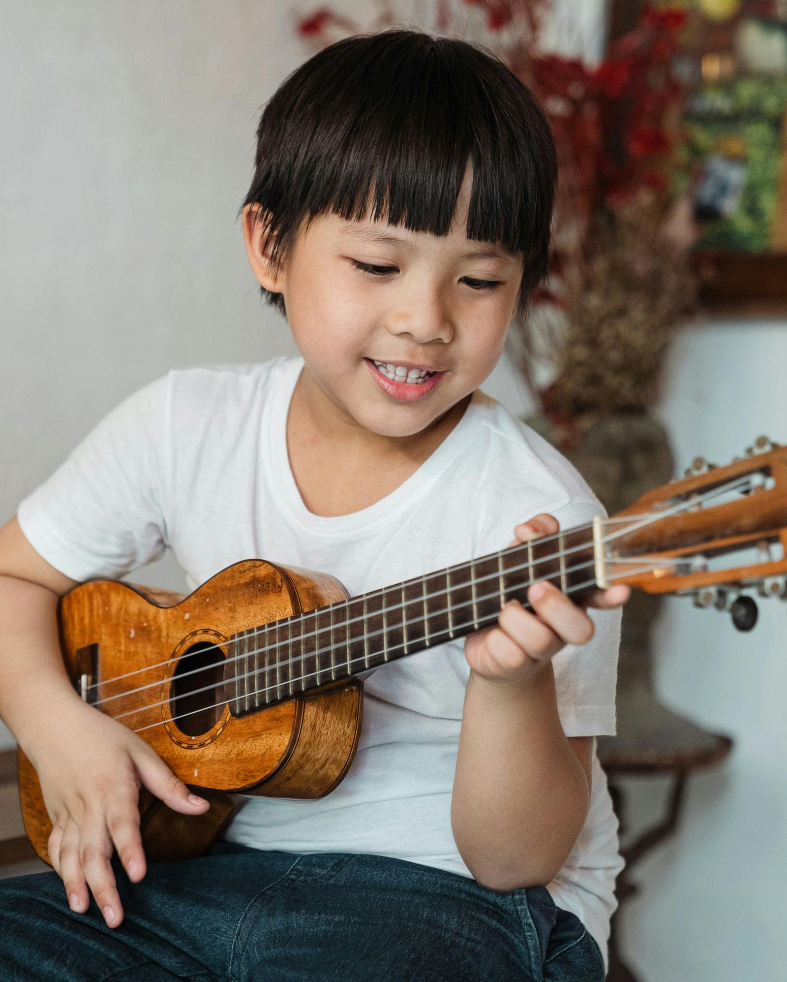 Child playing ukulele