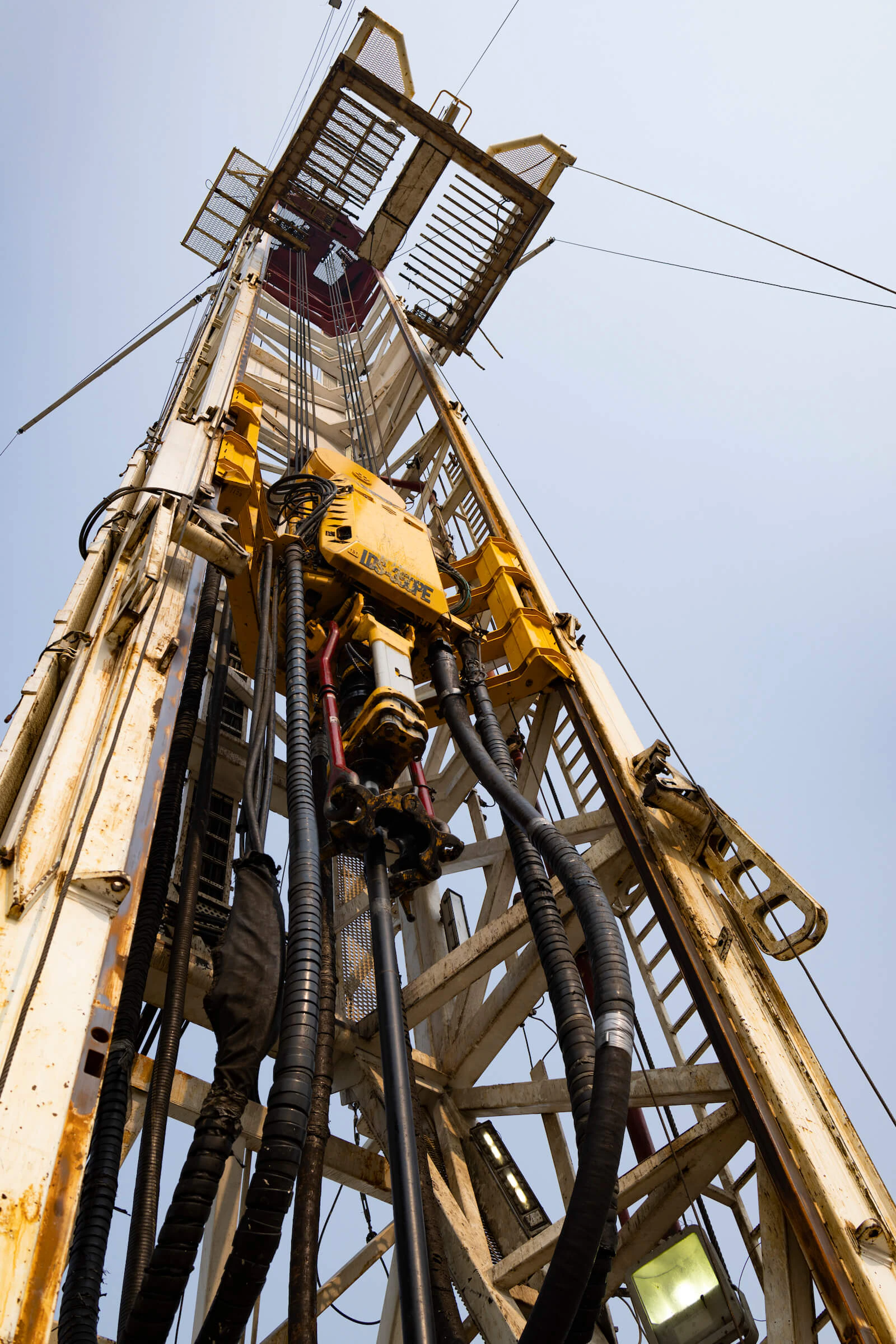 A tall yellow tower, meant for industrial use of some kind.