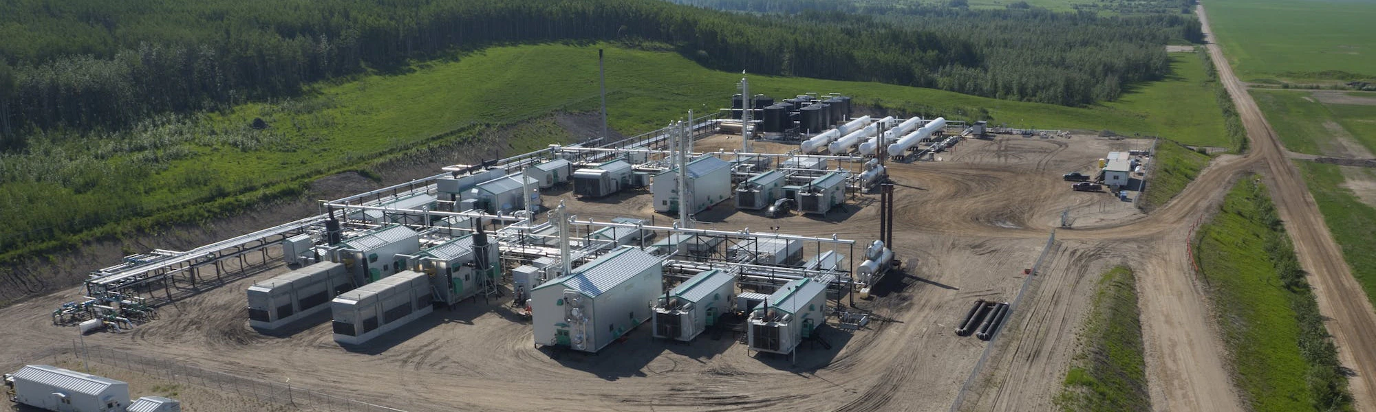 An aerial view of a gas plant during the day.