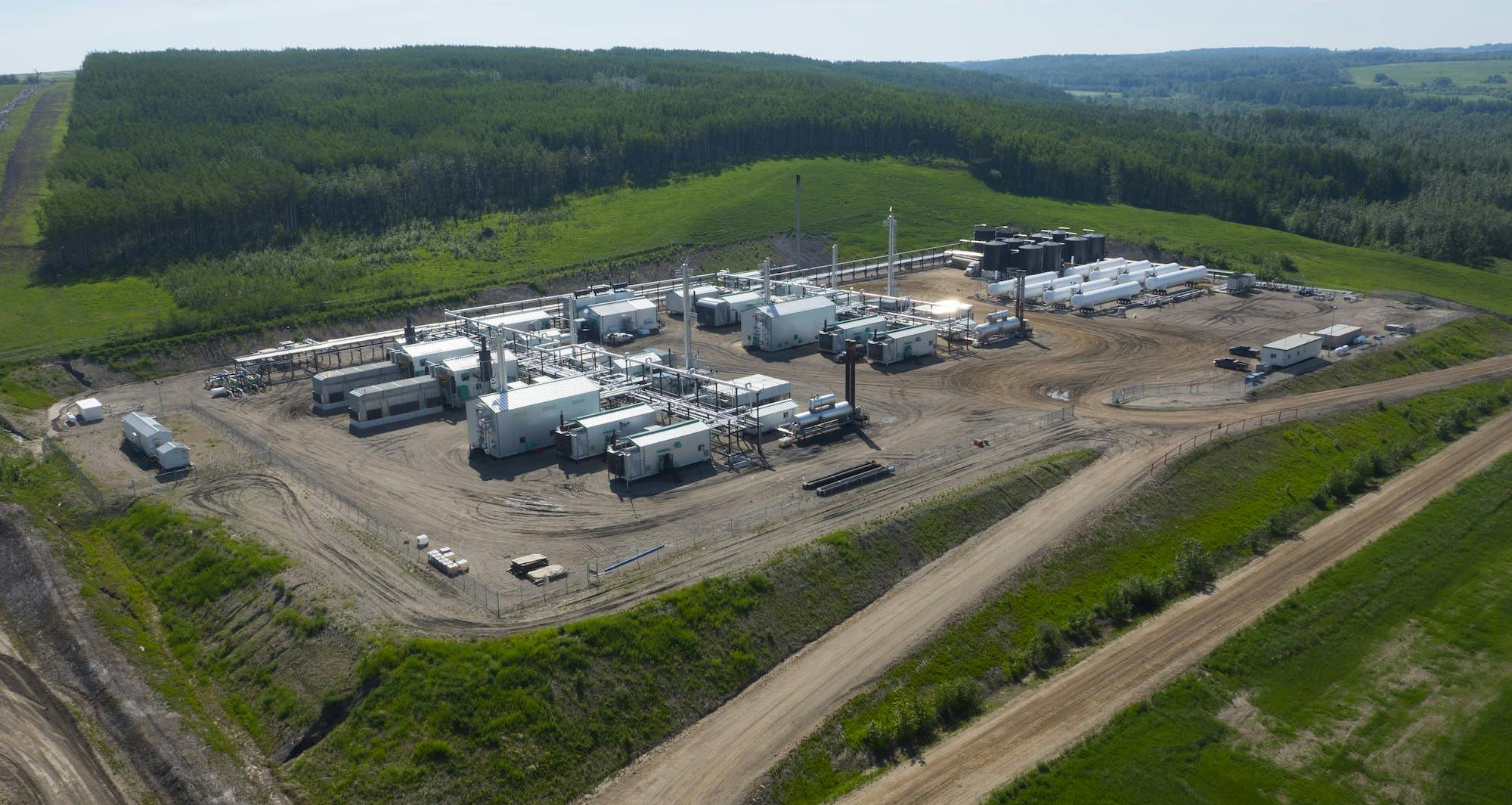An aerial view of a gas plant during the day.
