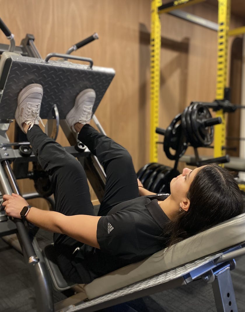 Sherry on the leg press equipment at the onsite gym
