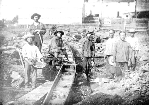 Early daguerrotype of Chinese immigrant miners working alongside European miners during the Gold Rush of the 1850s. 