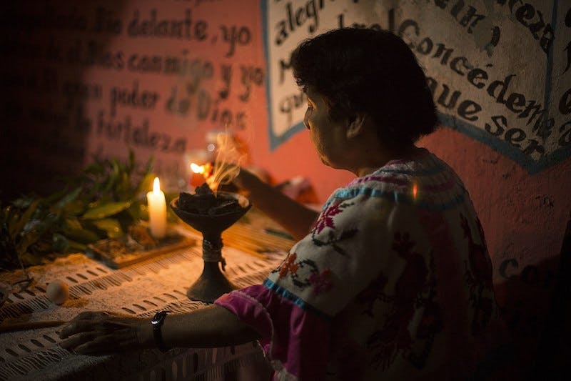 A curandera preparing a cleansing ceremony in Oaxaca. 