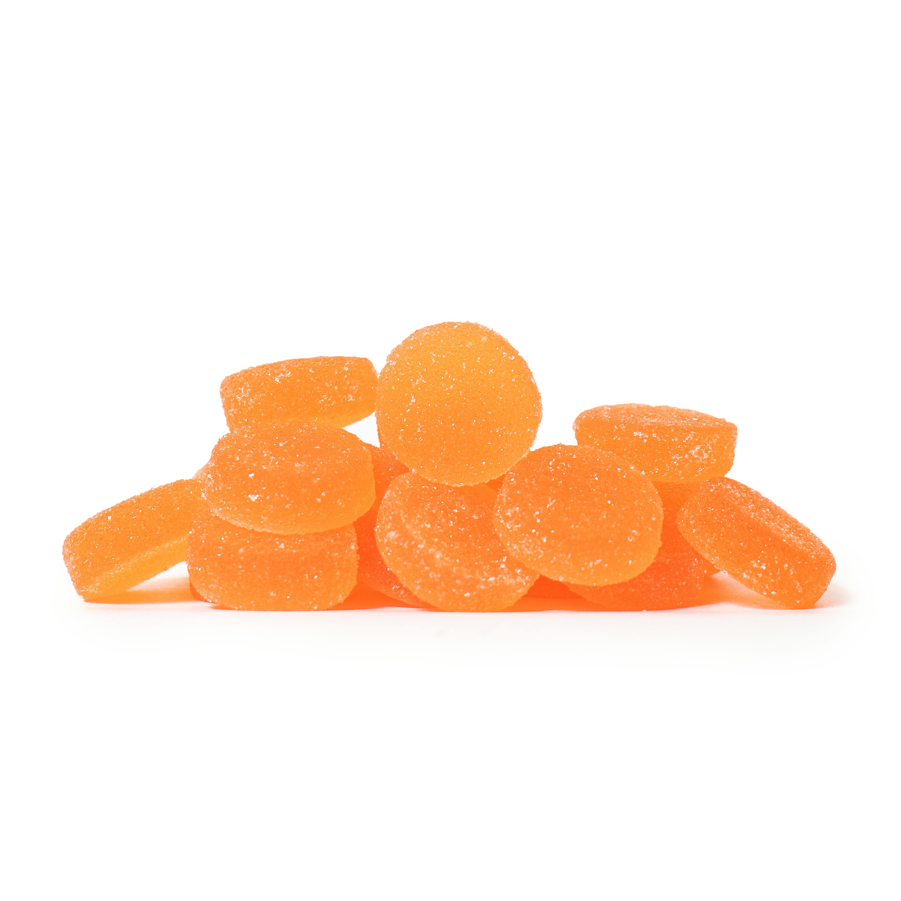 A pile of Citrus Spice Deli Nickels gummies.