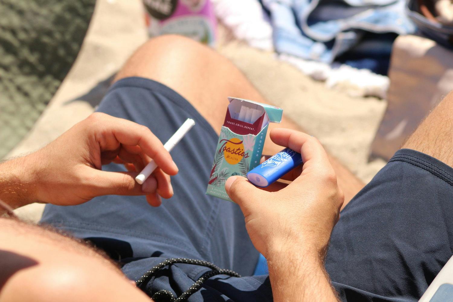 A man holding a pack of Toasties Classic