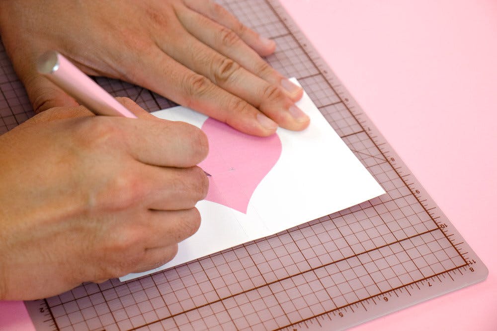 Use an Exato knife and cut along the dotted lines.