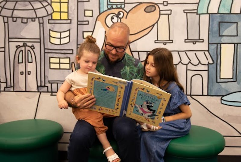 Family of three reading together