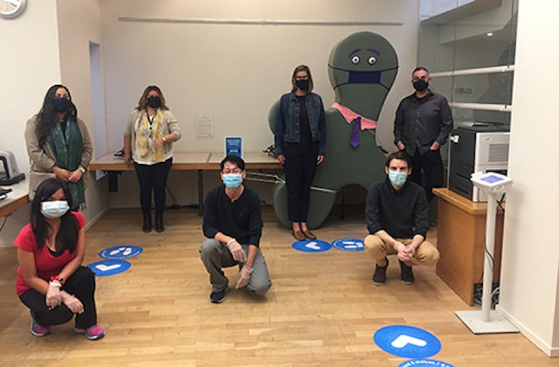 Library staff wearing masks inside branch