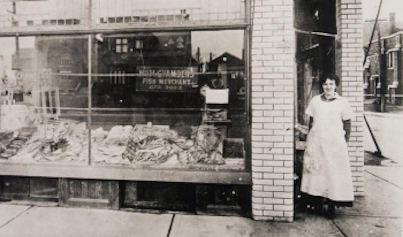 Vintage photo of woman by storefront