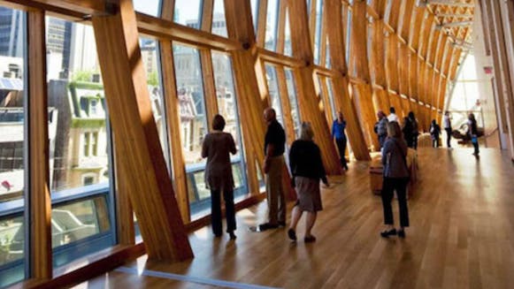 People walking around inside the Art Gallery of Ontario.