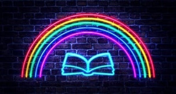 neon rainbow and book