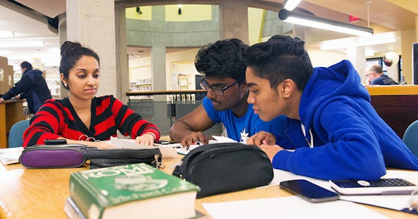 Teens studying at the library