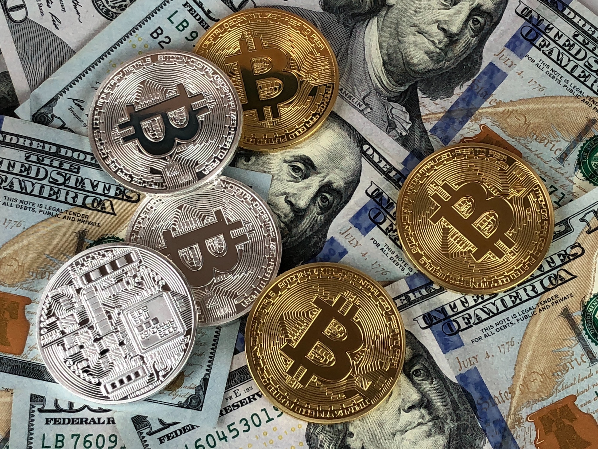 Bitcoin coins and banknotes