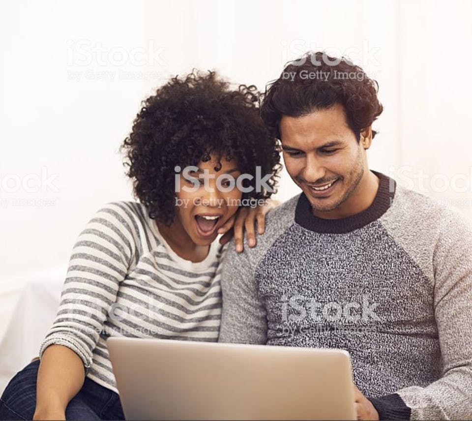 Friends reading about all the benefits you get as a Trade Nation member