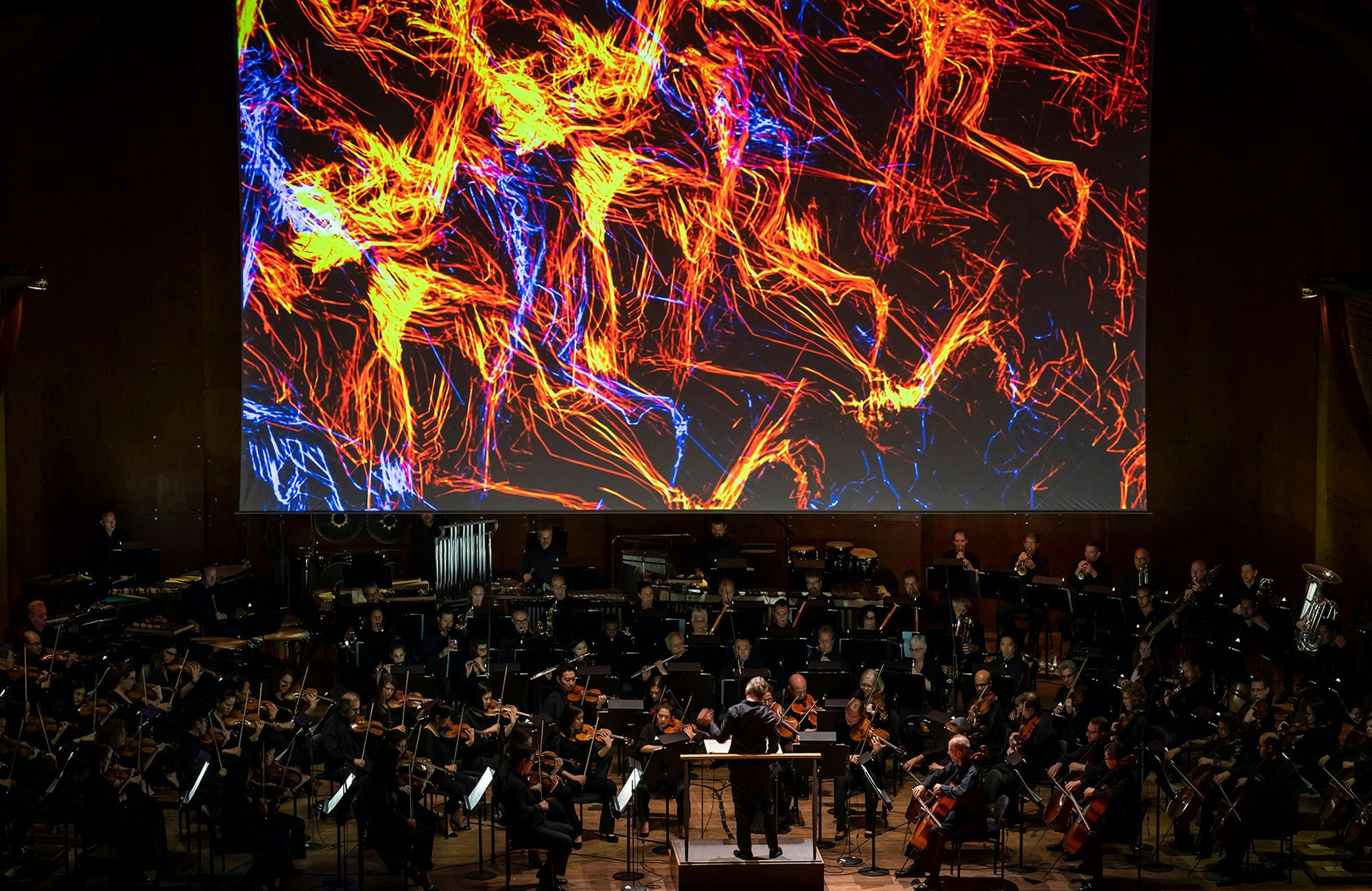 Foreign Bodies New York Philharmonic 2018 red blue particles