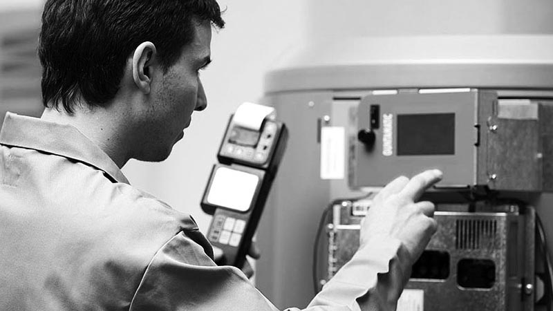 Treco Engineer programming and testing a Biomass Boiler Installation