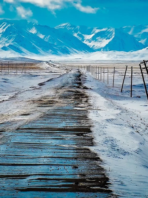 Road to snowy mountains