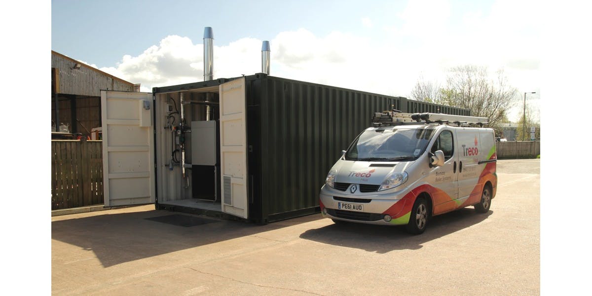 A containerised boiler plant room solution next to a Treco van