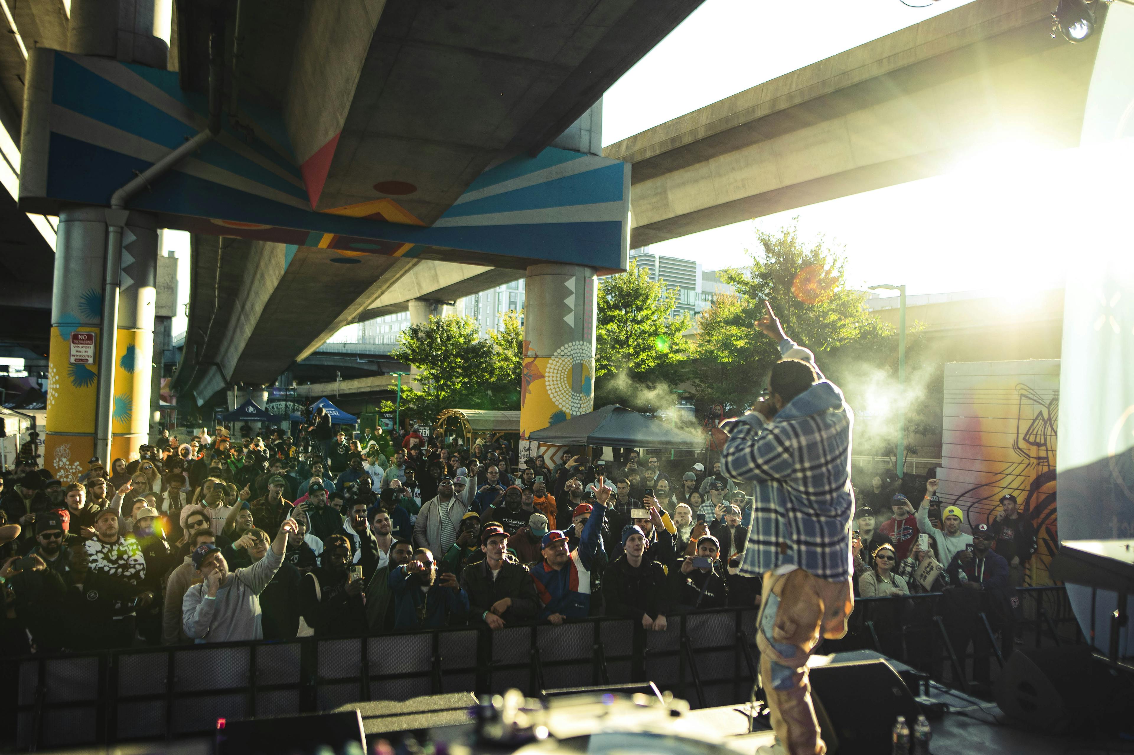A concert under a Boston overpass is filled with Boston Cannabis Week attendees. 