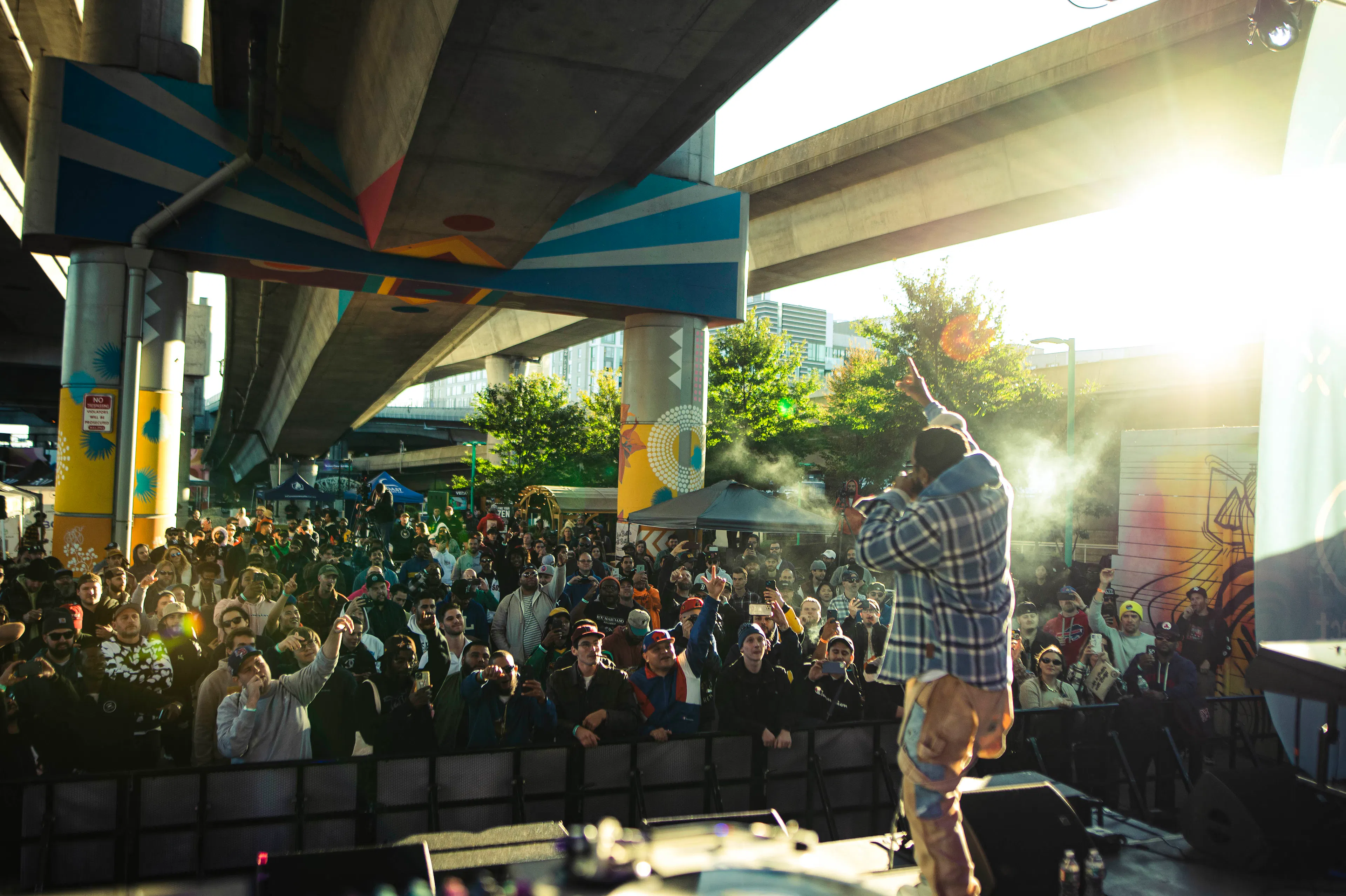A concert under a Boston overpass is filled with Boston Cannabis Week attendees. 