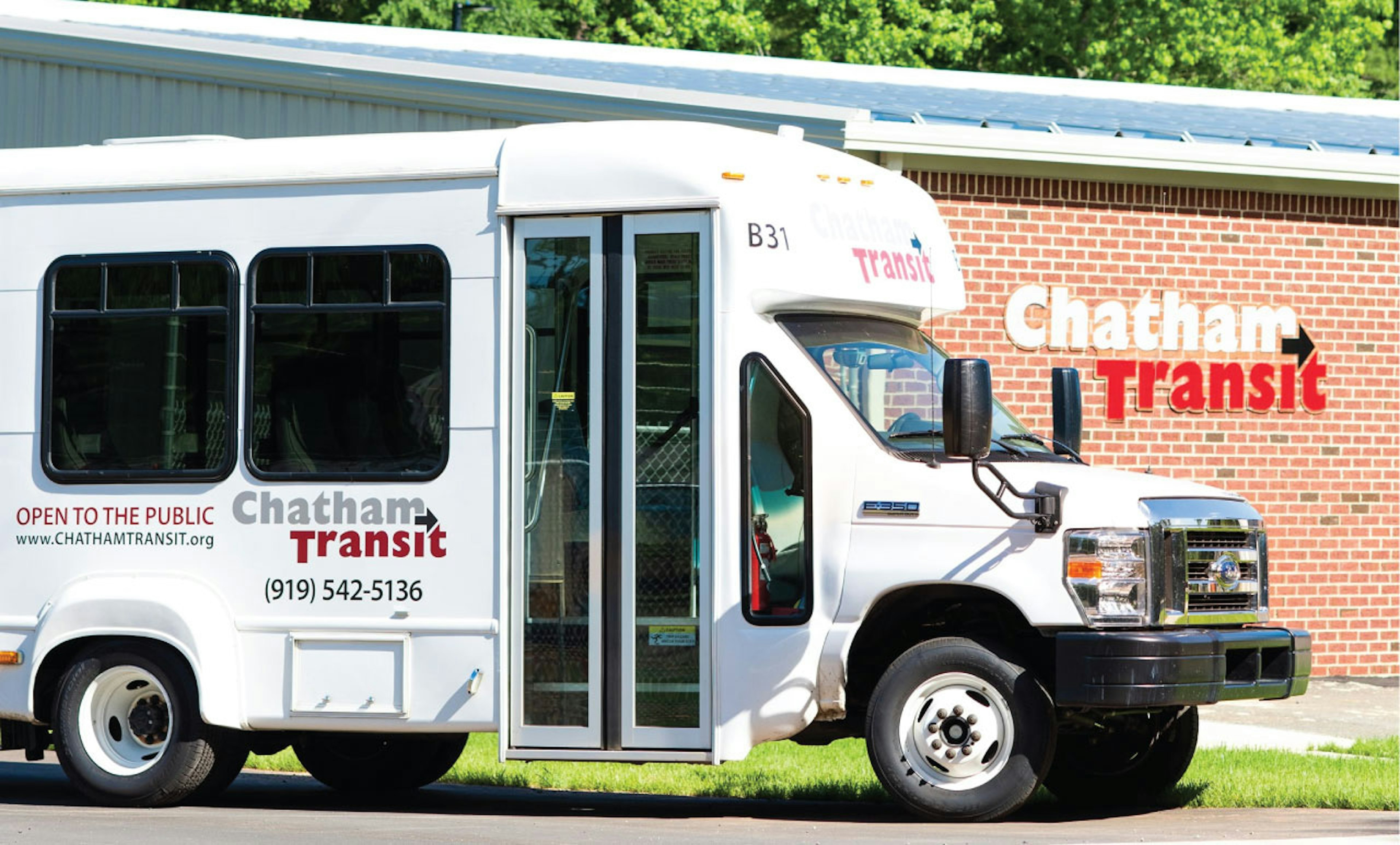 A white Chayham Transit shuttle