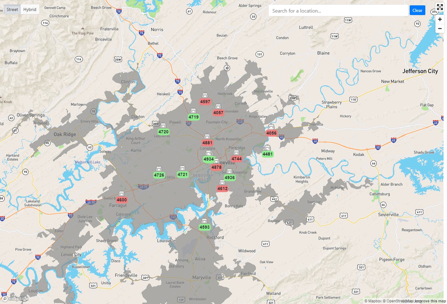 TripMaster mapping interface showing a regional map with vehicle locations marked in green and red.