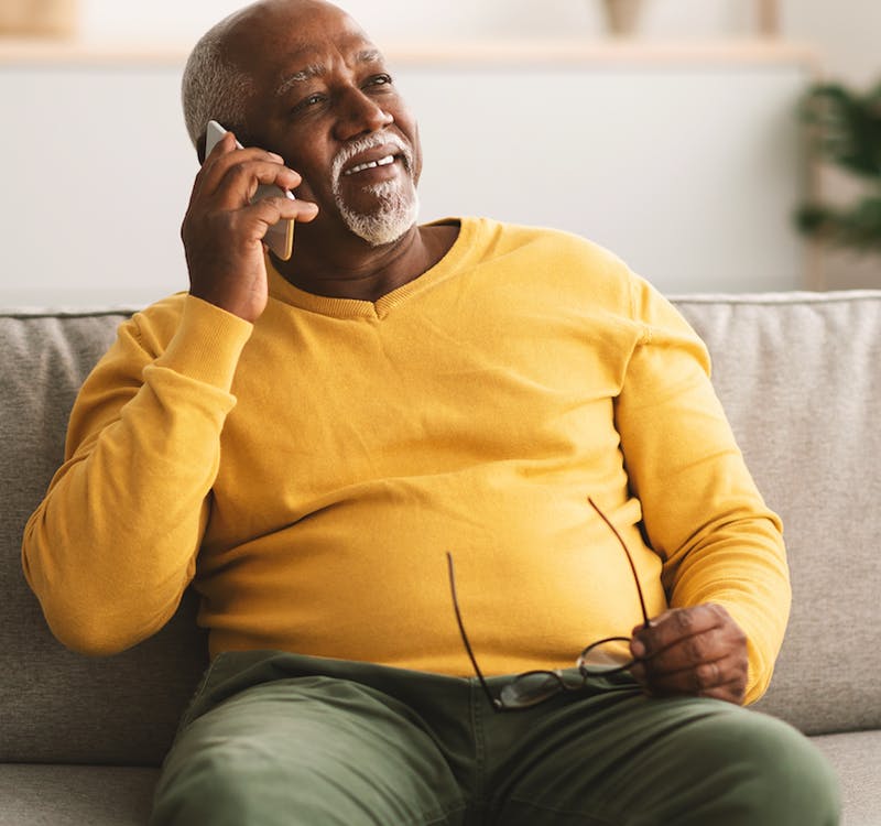 Man On Couch On Phone