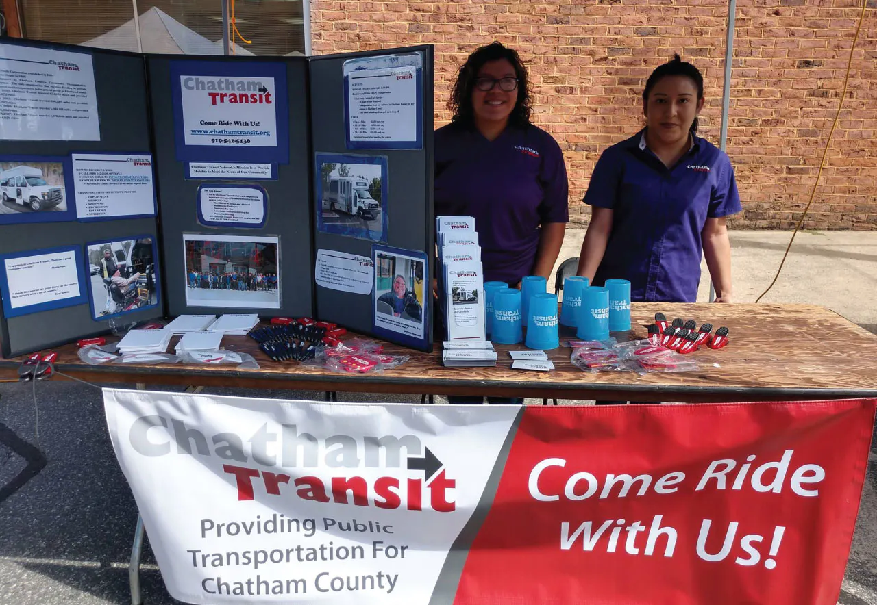 Image of workers at a Chatham Transit booth