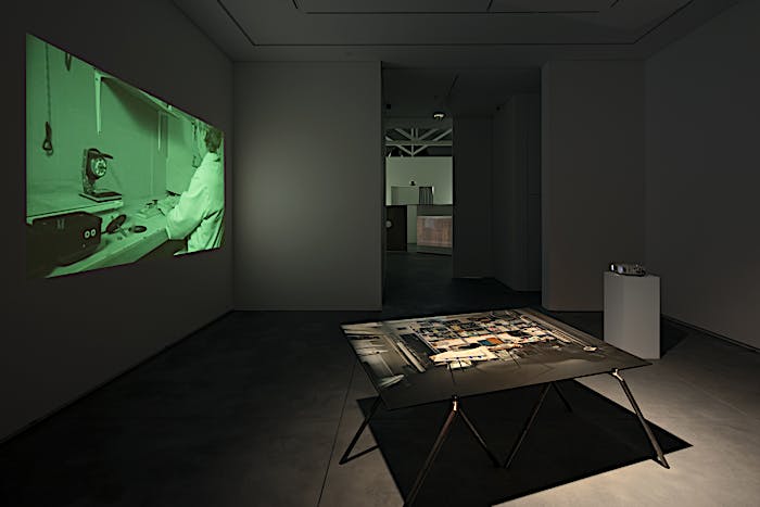Exhibition view of table installation Punctuation (3:54), 2018, and film installation Punctuations & Perforations, 2016. Solo exhibition Material Longevities at Galeria Francisco Fino, Lisbon. May 2018 until July 2018
