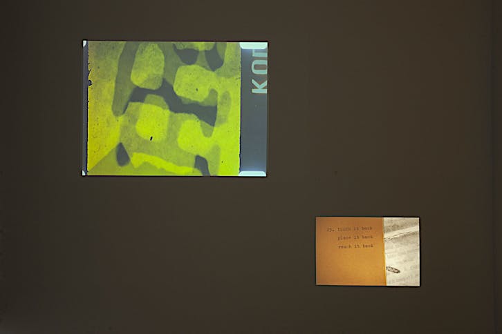 Henri Chopin and E.E. Vonna-Michell, To Ray The Rays, 1986-87, 16mm film transferred to video, sound, colour, 7 minutes 55 seconds; Tris Vonna-Michell, back segments, 2022, slide projection, 35 colour slides (35mm), audio, back segments publication by E.E. Vonna-Michell, 8 minutes 03 seconds. Installation view of Vonna-Michell: back segments at Jan Mot, Brussels, 2022, from left to right