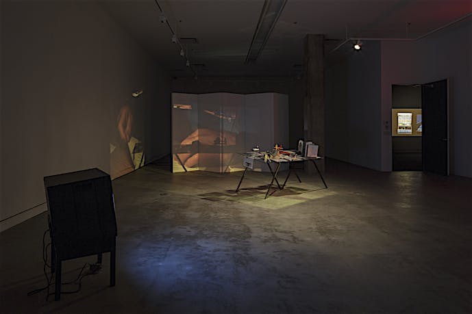 Exhibition view of table, video and 35mm slide projection Finding Chopin: Dans l’Essex, 2014, at Tris Vonna-Michell exhibition, VOX – Centre de l’image contemporaine, Montreal. February until April 2014
