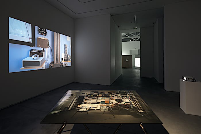Exhibition view of table installation Punctuation (3:54), 2018, and film installation Punctuations & Perforations, 2016. Solo exhibition Material Longevities at Galeria Francisco Fino, Lisbon. May 2018 until July 2018