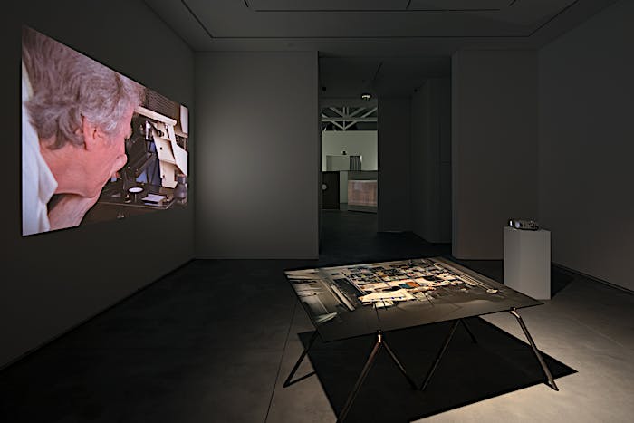 Exhibition view of table installation Punctuation (3:54), 2018, and film installation Punctuations & Perforations, 2016. Solo exhibition Material Longevities at Galeria Francisco Fino, Lisbon. May 2018 until July 2018