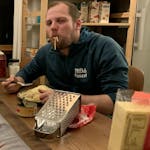 A man eating cheese.