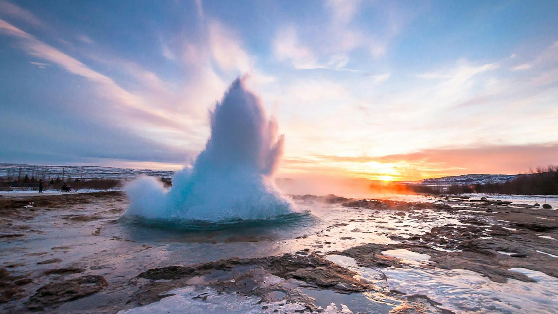 Geysir starting spewing boiling water in the air.