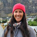 profile photo of a girl with long hair using a red hat