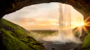 A waterfall photograph during a sunset.