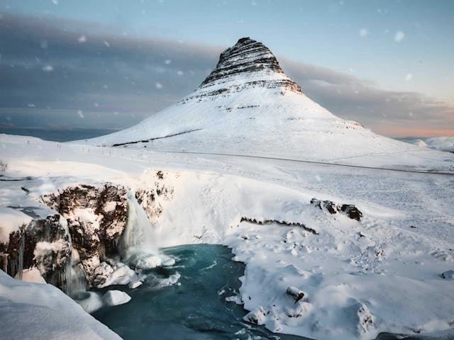 Kirkjufell cove3red with snow in Iceland