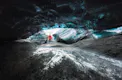 Person in distance touching the pieces of ice.