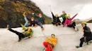 A group of happy people chilling and having fun on a glacier.