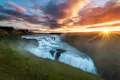 Powerfull waterfall on a canyon during the sunrise.