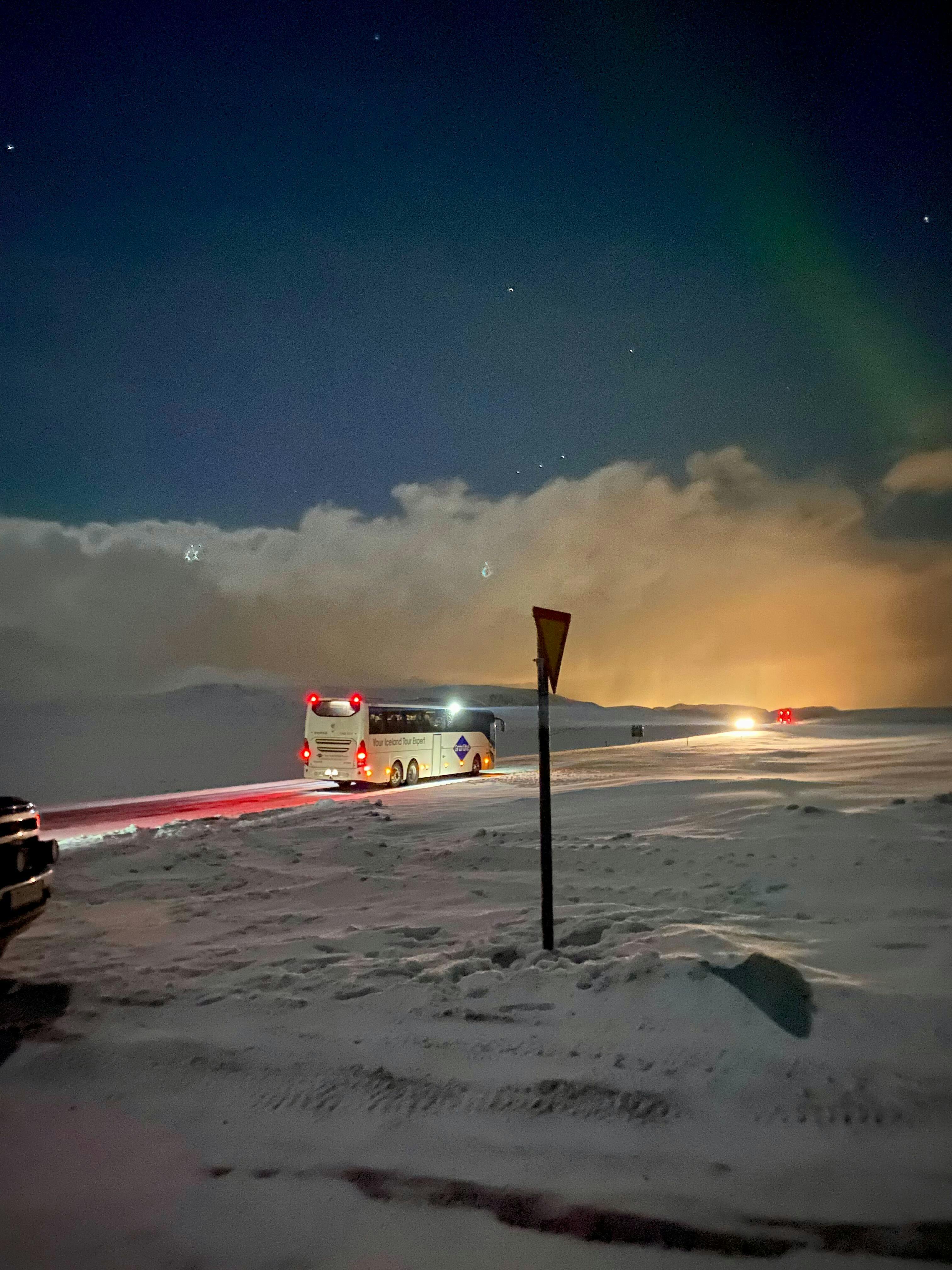 Aurora bus in Iceland winter