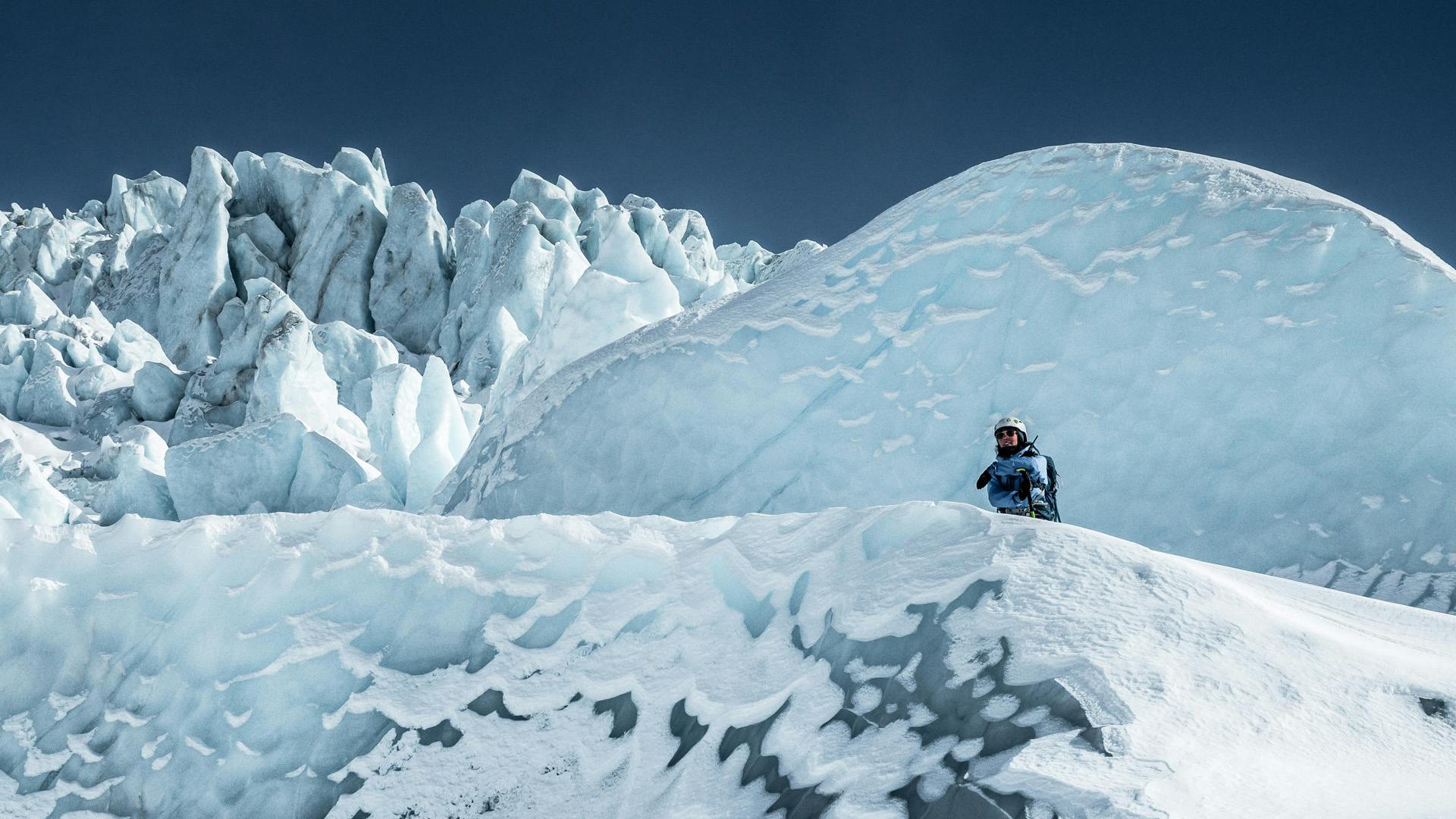 A person enjoying the time on a glacier.